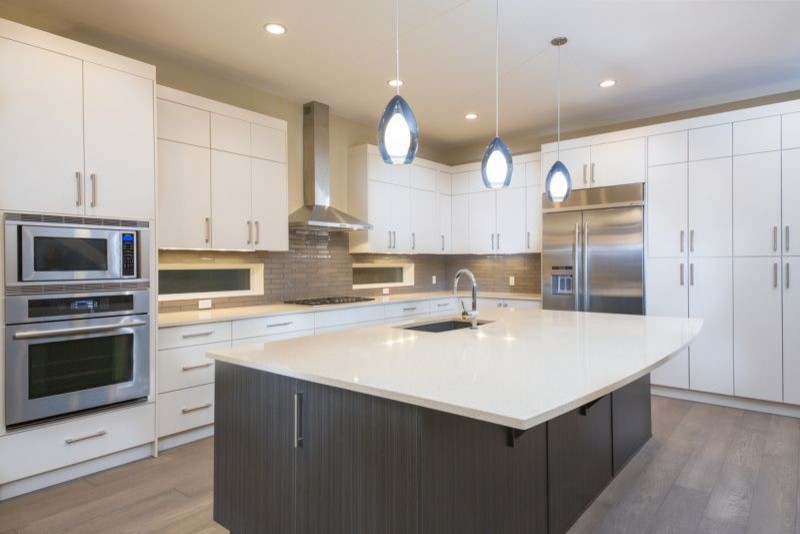 Example of a transitional kitchen design in Calgary