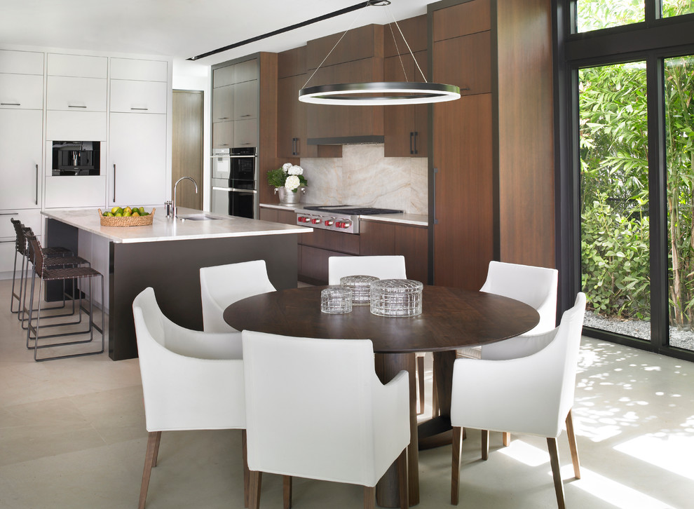 This is an example of a contemporary galley eat-in kitchen in Miami with an undermount sink, flat-panel cabinets, medium wood cabinets, beige splashback, with island, beige floor and beige benchtop.