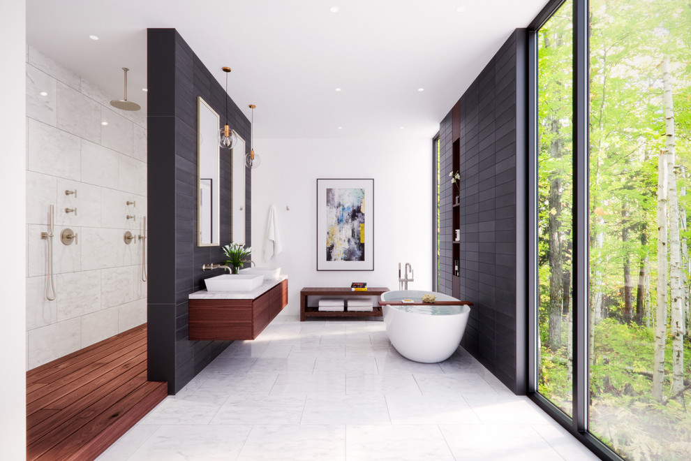 This is an example of an expansive contemporary master bathroom in Cincinnati with flat-panel cabinets, dark wood cabinets, a freestanding tub, an open shower, black and white tile, ceramic tile, white walls, a vessel sink, an open shower and white floor.