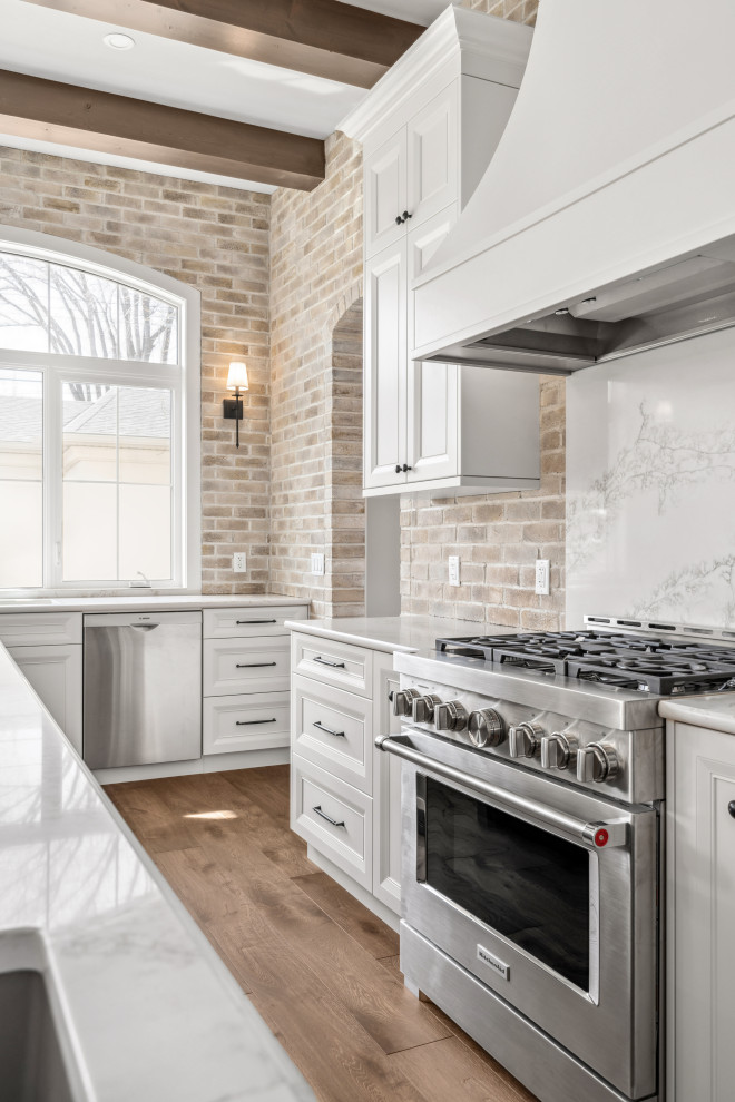 Example of a transitional kitchen design in Calgary