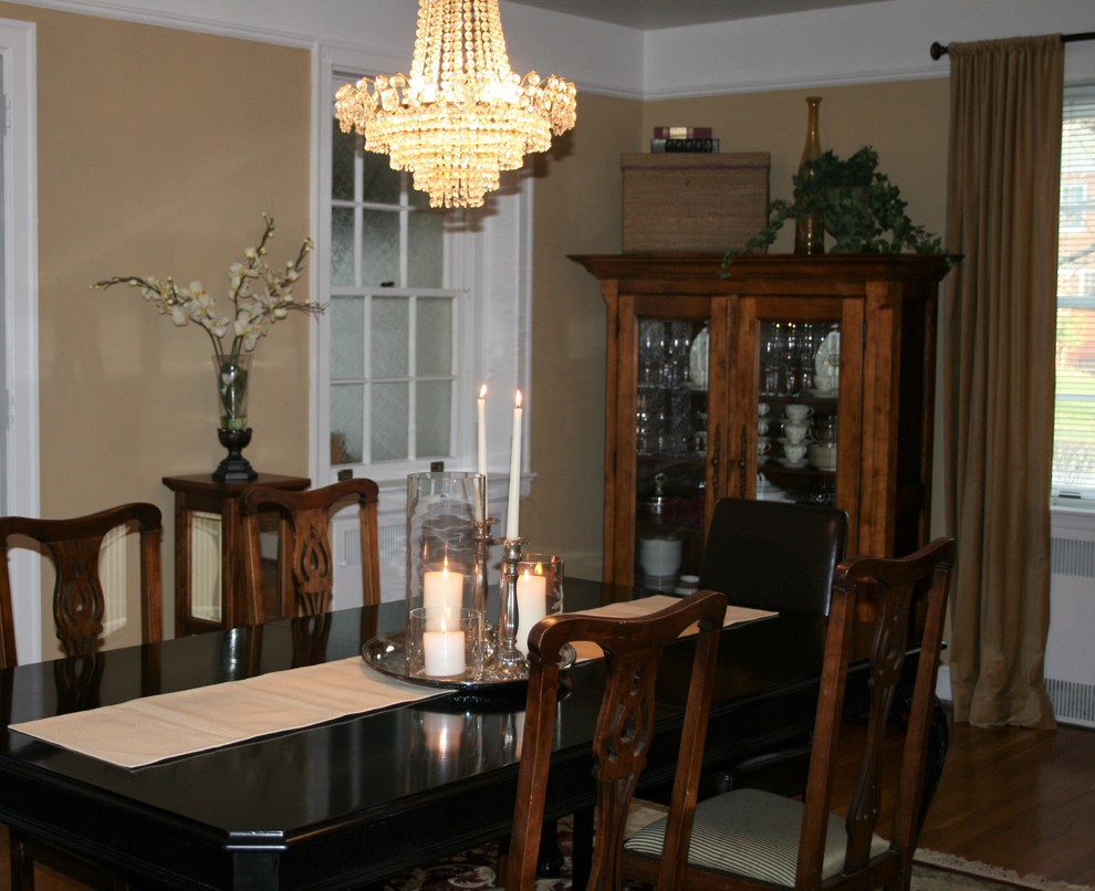 Design ideas for a mid-sized traditional separate dining room in Other with beige walls and medium hardwood floors.