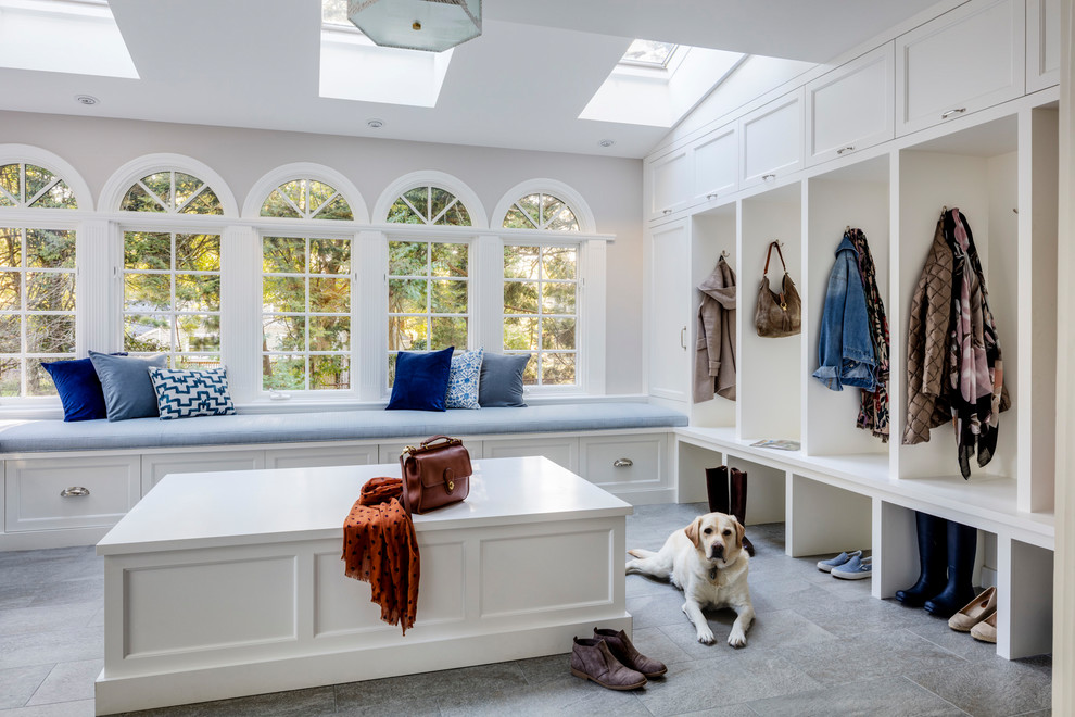 Large transitional mudroom in Boston with grey walls, ceramic floors and grey floor.