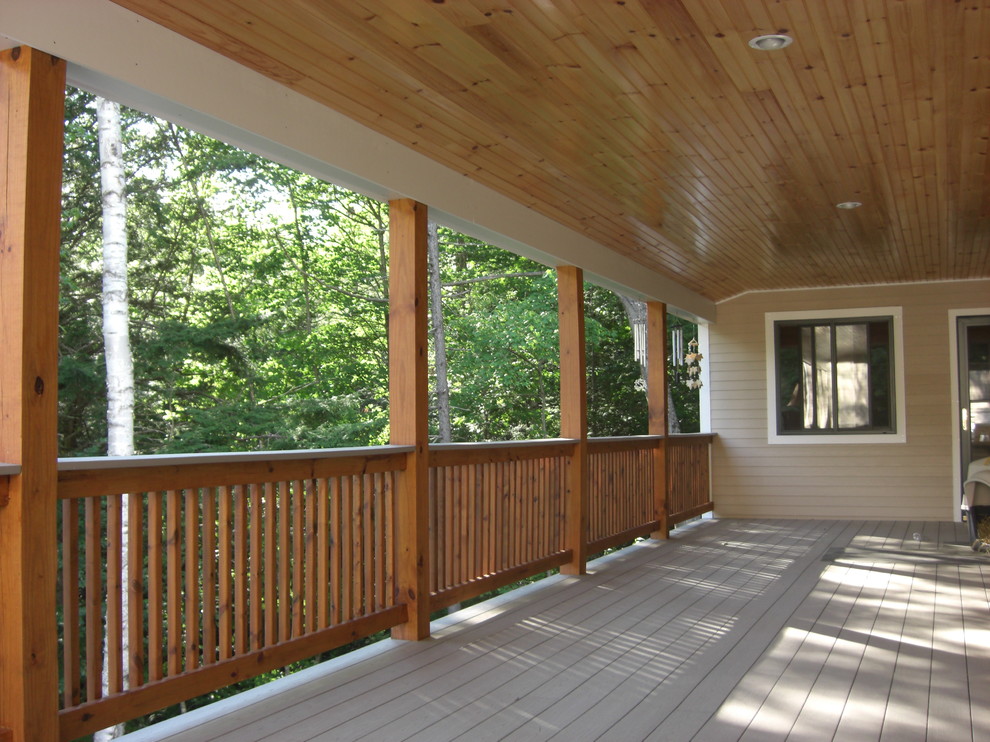 Inspiration for a large rustic deck remodel in Boston with a roof extension