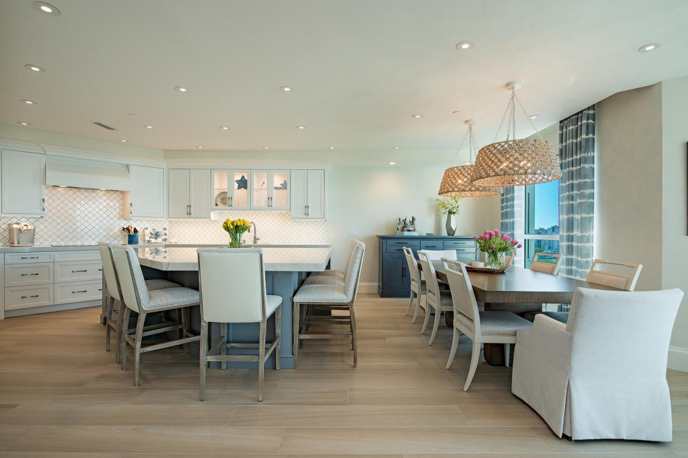 Design ideas for a large beach style dining room in Miami with beige walls.