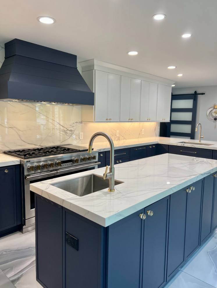 Inspiration for an expansive contemporary single-wall separate kitchen in Detroit with an undermount sink, flat-panel cabinets, granite benchtops, white splashback, granite splashback, panelled appliances, porcelain floors, with island, blue floor, white benchtop and blue cabinets.