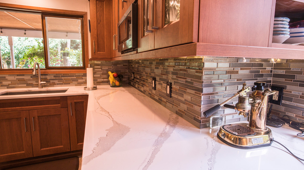 Huge u-shaped porcelain tile and multicolored floor eat-in kitchen photo in Seattle with an undermount sink, shaker cabinets, medium tone wood cabinets, quartz countertops, multicolored backsplash, mosaic tile backsplash, stainless steel appliances and a peninsula