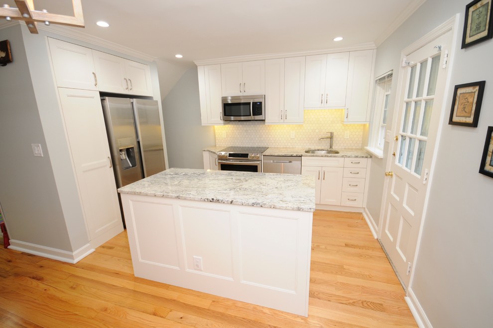 Eat-in kitchen - small l-shaped light wood floor eat-in kitchen idea in DC Metro with a single-bowl sink, shaker cabinets, white cabinets, granite countertops, white backsplash, mosaic tile backsplash, stainless steel appliances and an island
