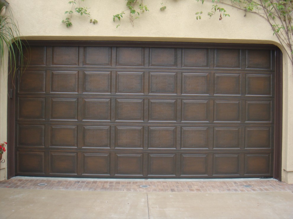 This is an example of a mid-sized traditional attached two-car garage in Orange County.