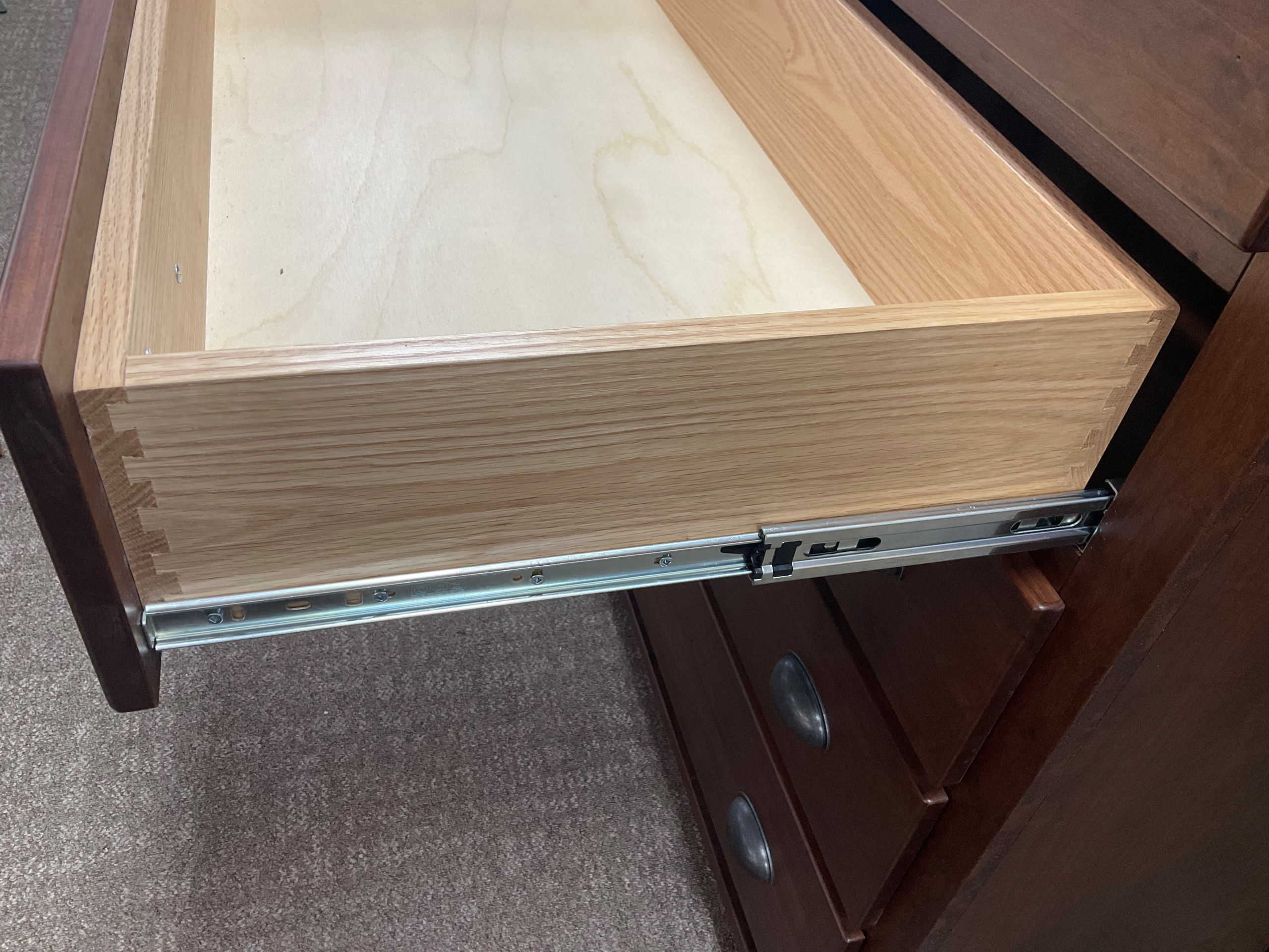 Dovetailed drawer boxes and full extension ball bearing slides.