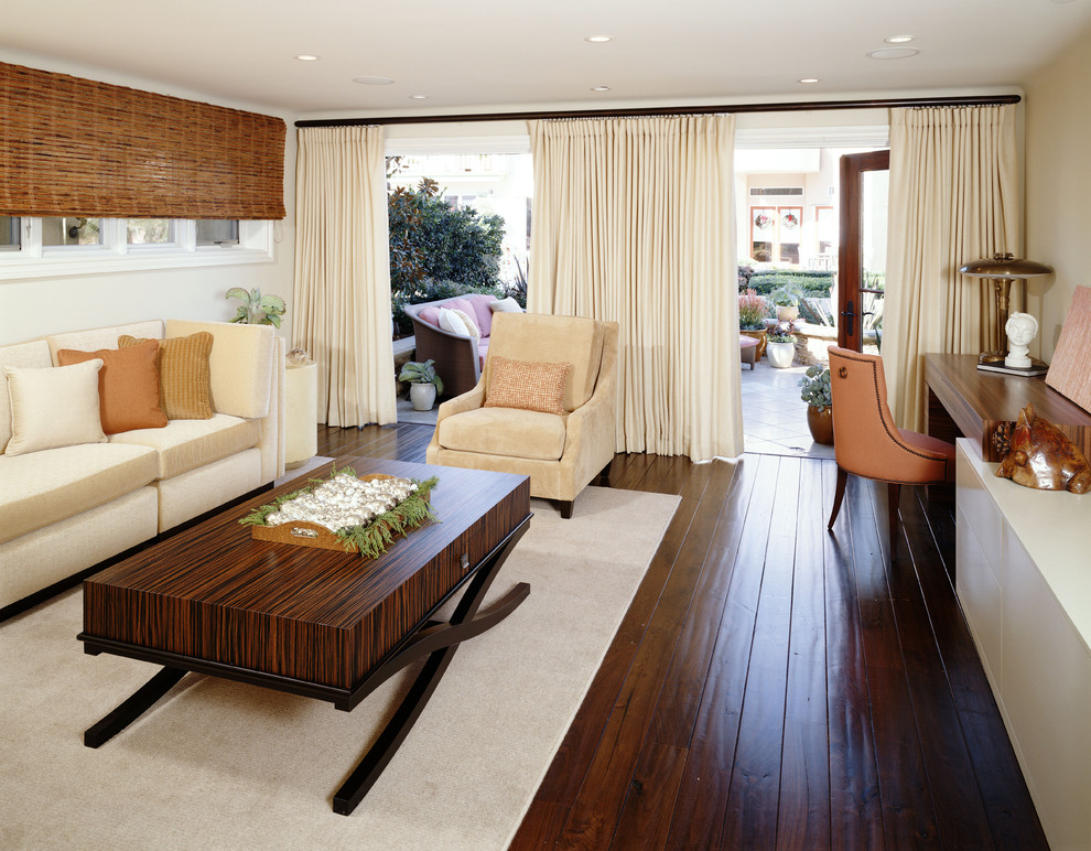 Photo of a contemporary family room in Los Angeles with beige walls and dark hardwood floors.