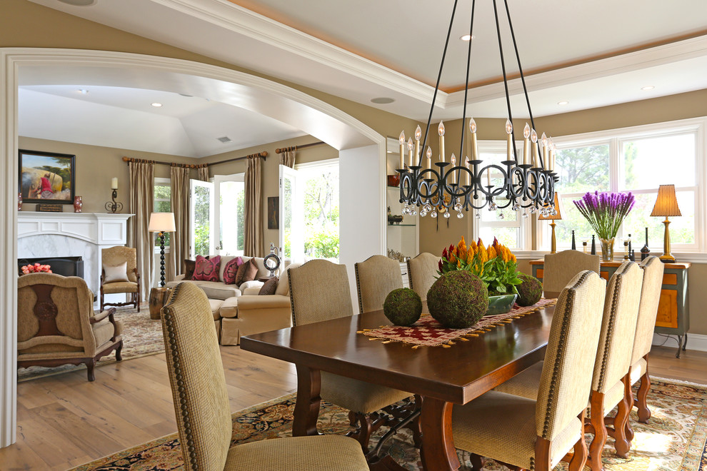 Mid-sized traditional separate dining room in Los Angeles with medium hardwood floors and beige walls.