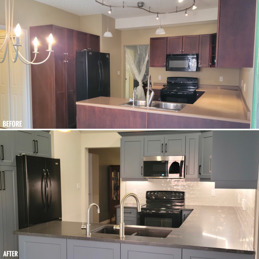 Eat-in kitchen - mid-sized transitional u-shaped vinyl floor eat-in kitchen idea with an undermount sink, recessed-panel cabinets, blue cabinets, quartzite countertops, white backsplash, porcelain backsplash, black appliances, a peninsula and black countertops