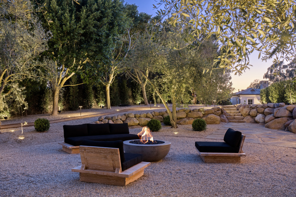 Design ideas for a transitional patio in Los Angeles with gravel and no cover.