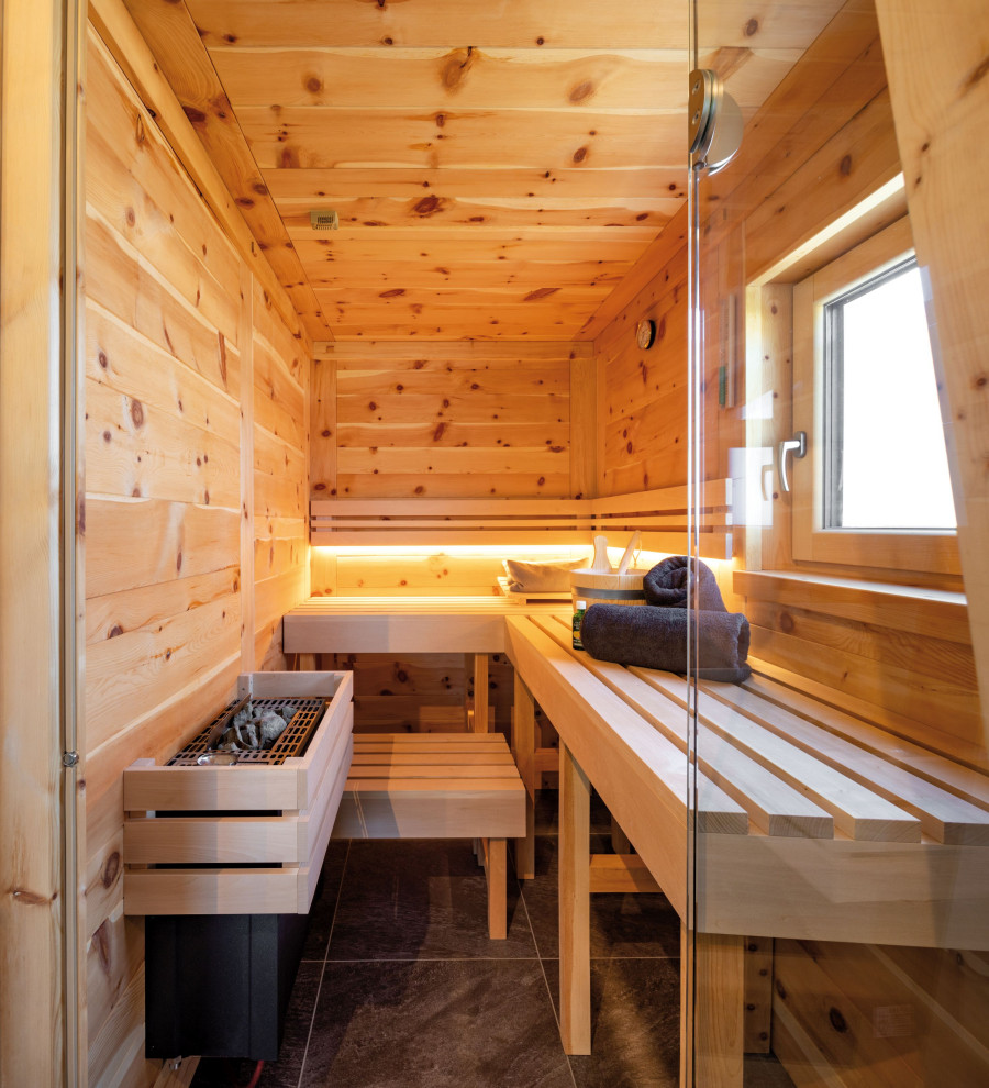 Inspiration for a medium sized classic sauna bathroom in Munich with beaded cabinets, brown cabinets, a freestanding bath, a built-in shower, grey tiles, brown walls, a vessel sink, wooden worktops, an open shower, grey worktops, double sinks and a floating vanity unit.