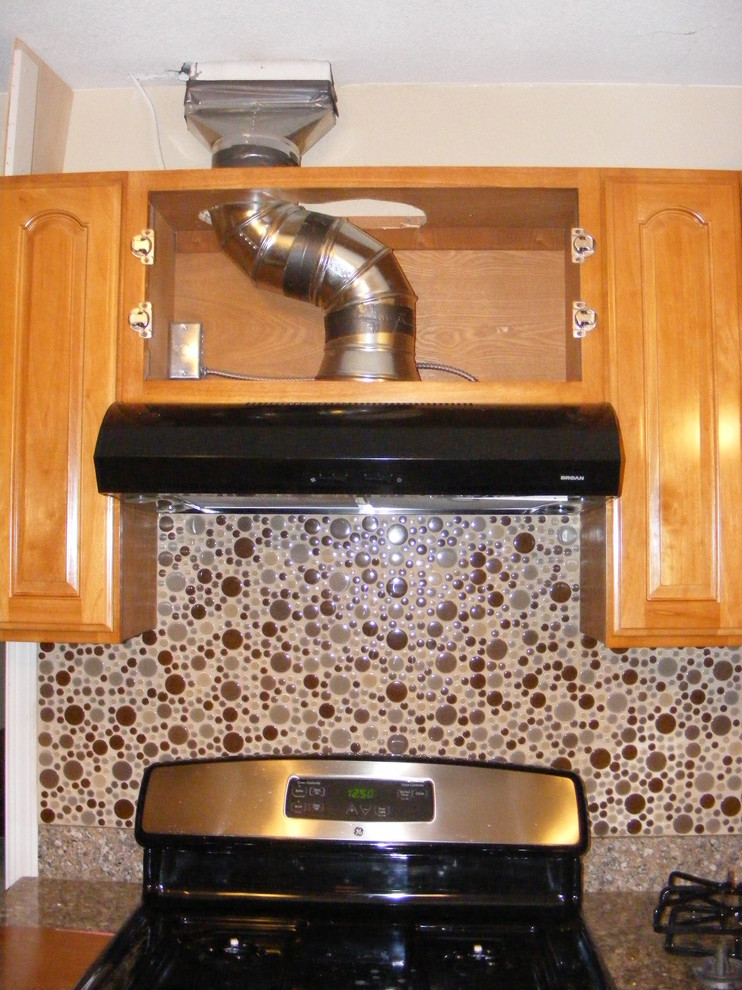 Please help,I need ideas on how to coverup,hide the range hood ducting