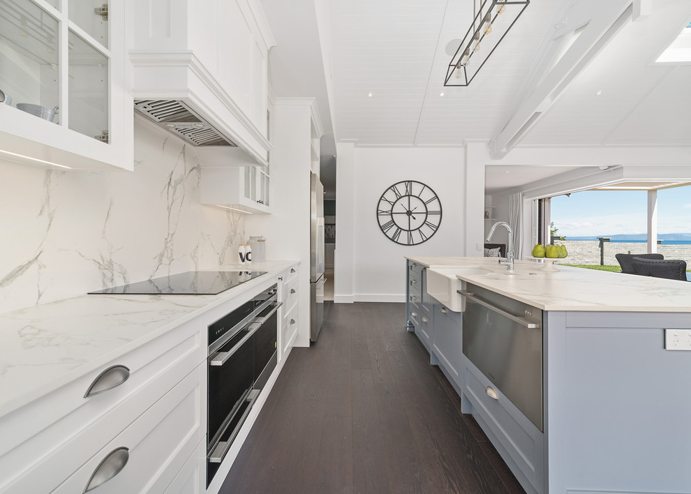 Mid-sized modern single-wall open plan kitchen in Other with open cabinets, white cabinets, dark hardwood floors, with island and black floor.