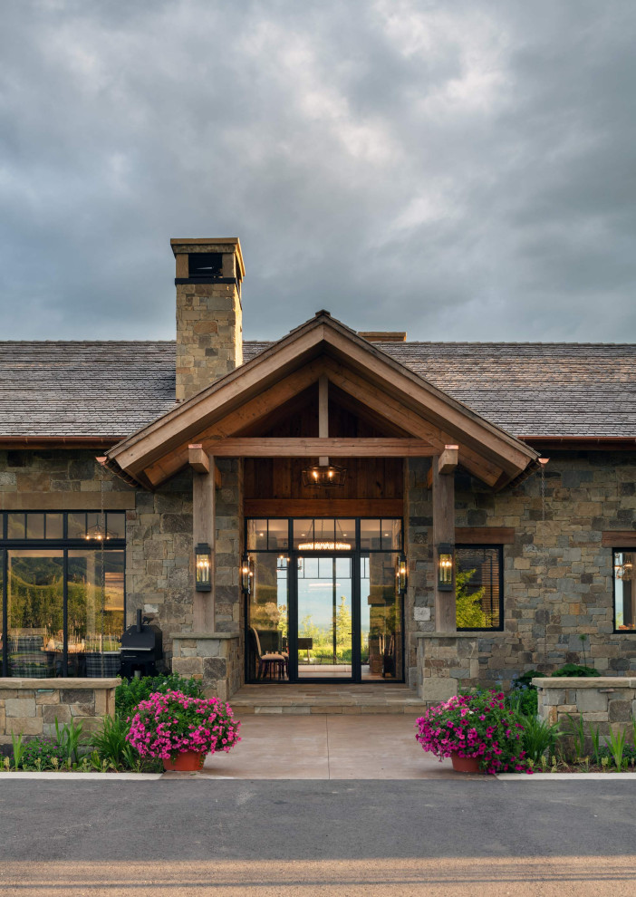 Inspiration for a rustic front door remodel with a glass front door