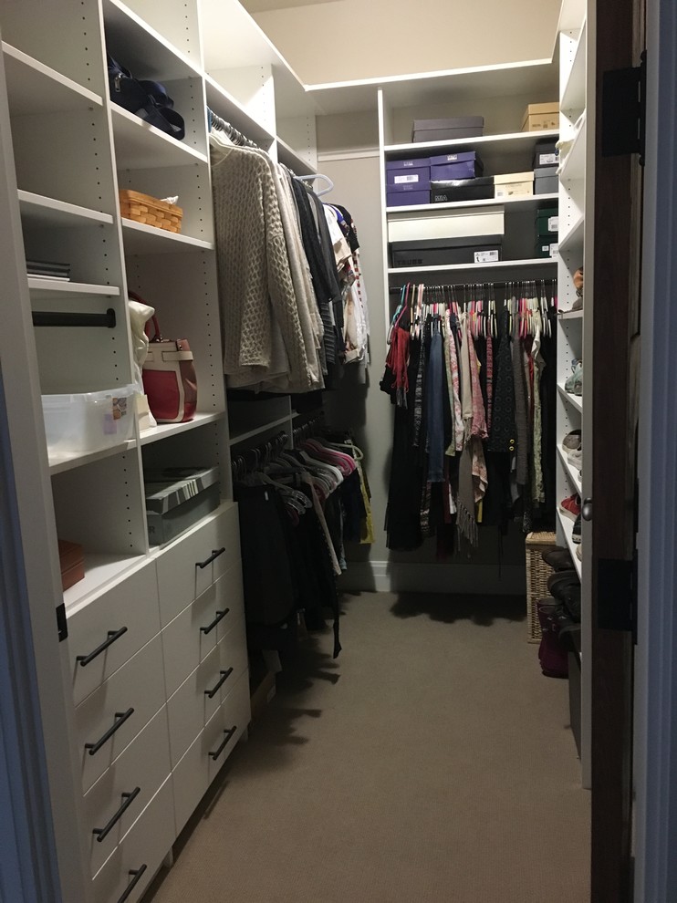 Example of a mid-sized transitional gender-neutral carpeted and gray floor walk-in closet design in Denver with flat-panel cabinets and white cabinets