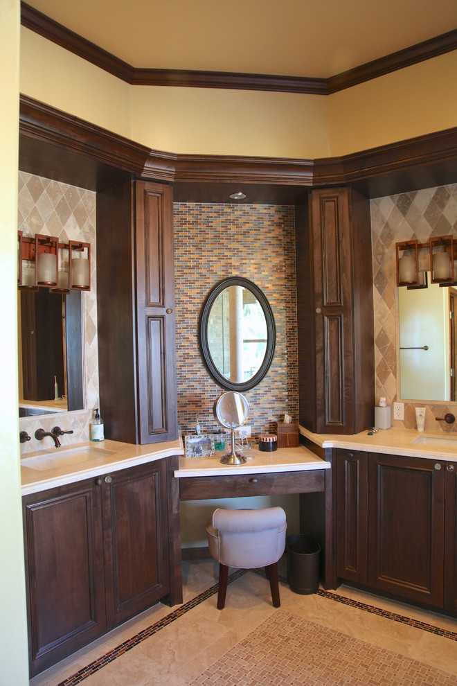 Large traditional master bathroom in Phoenix with an undermount sink, beaded inset cabinets, dark wood cabinets, limestone benchtops, a drop-in tub, an alcove shower, beige tile, stone tile, yellow walls and limestone floors.