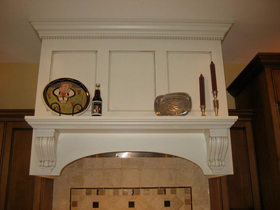 Inspiration for a mid-sized transitional l-shaped dark wood floor open concept kitchen remodel in Milwaukee with a double-bowl sink, recessed-panel cabinets, dark wood cabinets, granite countertops, beige backsplash, stone tile backsplash, stainless steel appliances and an island