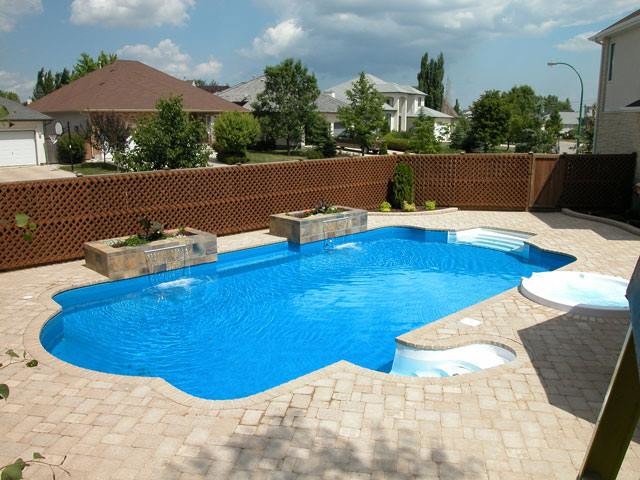 Inspiration for a large timeless backyard stone and custom-shaped natural pool fountain remodel