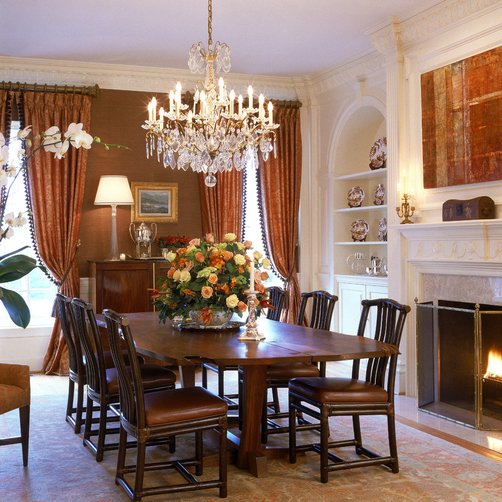 Photo of a large traditional dining room in DC Metro with brown walls, a standard fireplace and a stone fireplace surround.