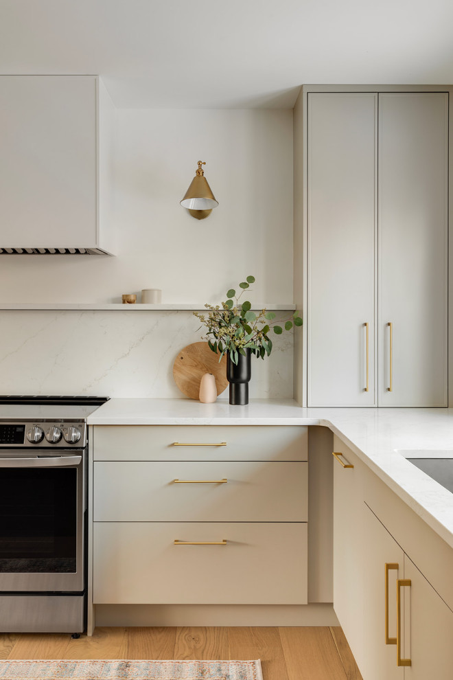 Example of a transitional kitchen design in Calgary