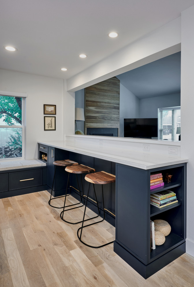 Example of a transitional home design design in Denver
