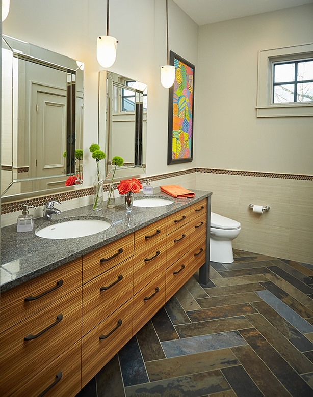 This is an example of a large transitional bathroom in Grand Rapids with flat-panel cabinets, medium wood cabinets, grey walls, porcelain floors, an undermount sink, engineered quartz benchtops and multi-coloured floor.