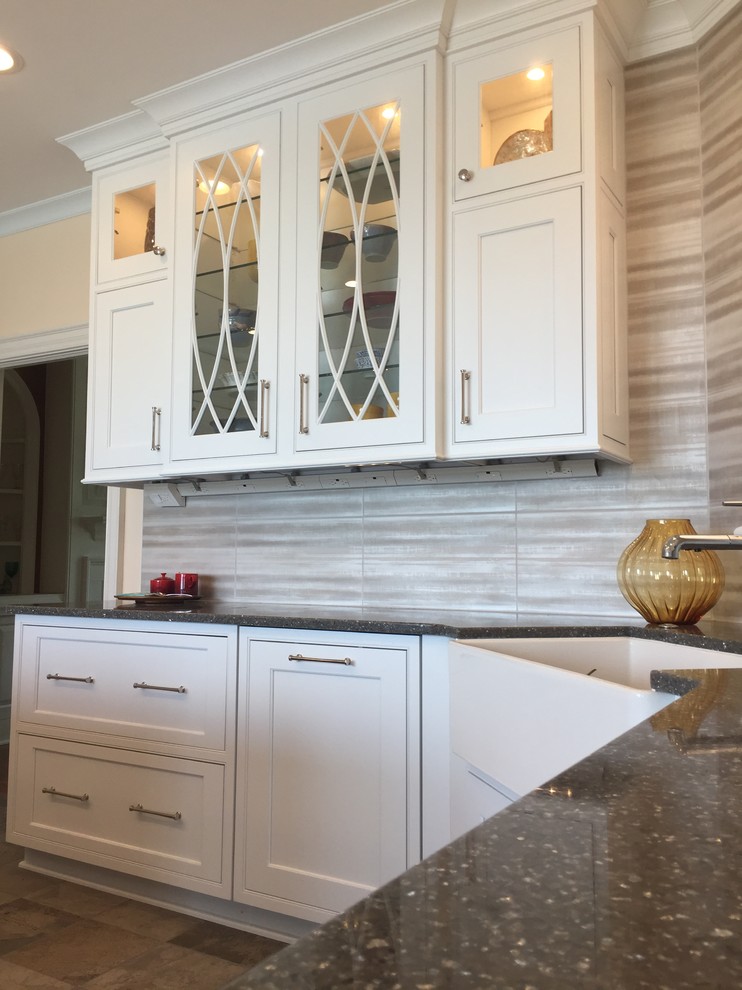 Kitchen - large transitional ceramic tile and multicolored floor kitchen idea with a farmhouse sink, beaded inset cabinets, white cabinets, quartz countertops, metallic backsplash, ceramic backsplash, stainless steel appliances and an island