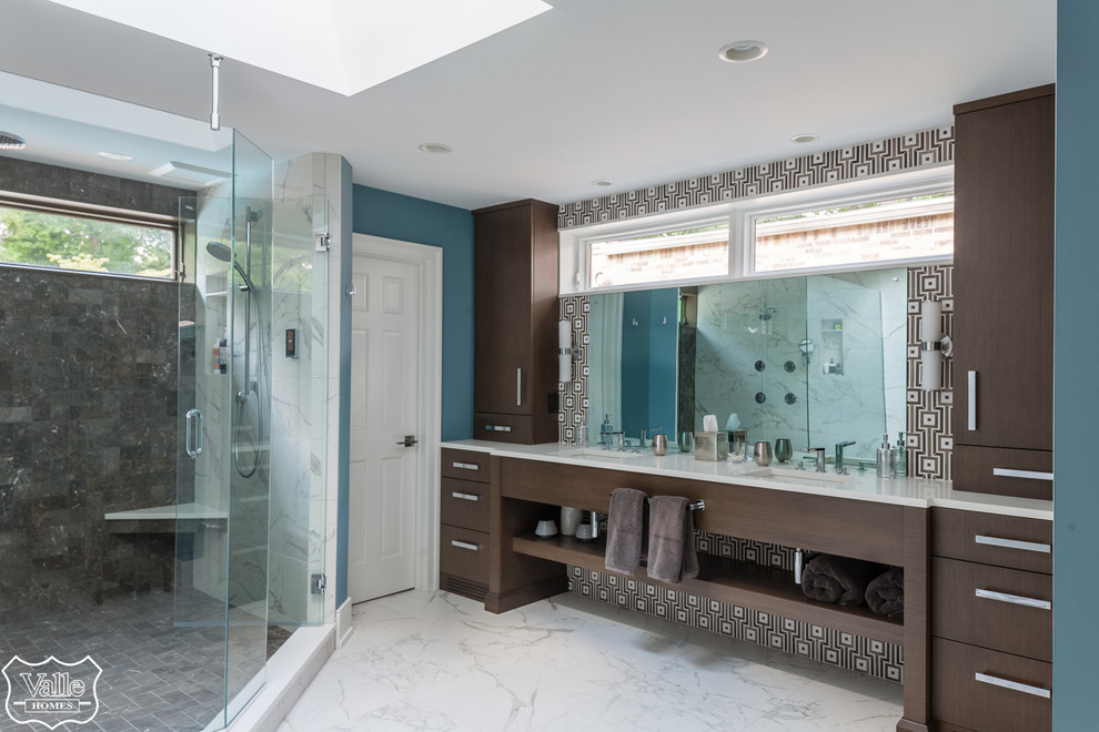 Inspiration for a large transitional master brown tile and ceramic tile porcelain tile and white floor freestanding bathtub remodel with flat-panel cabinets, brown cabinets, a bidet, blue walls, an undermount sink, wood countertops, a hinged shower door and brown countertops