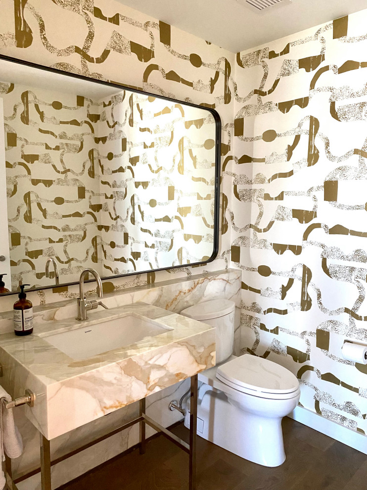 This is an example of a mid-sized contemporary powder room in New York with open cabinets, yellow cabinets, a two-piece toilet, white tile, ceramic tile, a drop-in sink, engineered quartz benchtops, yellow benchtops and a built-in vanity.