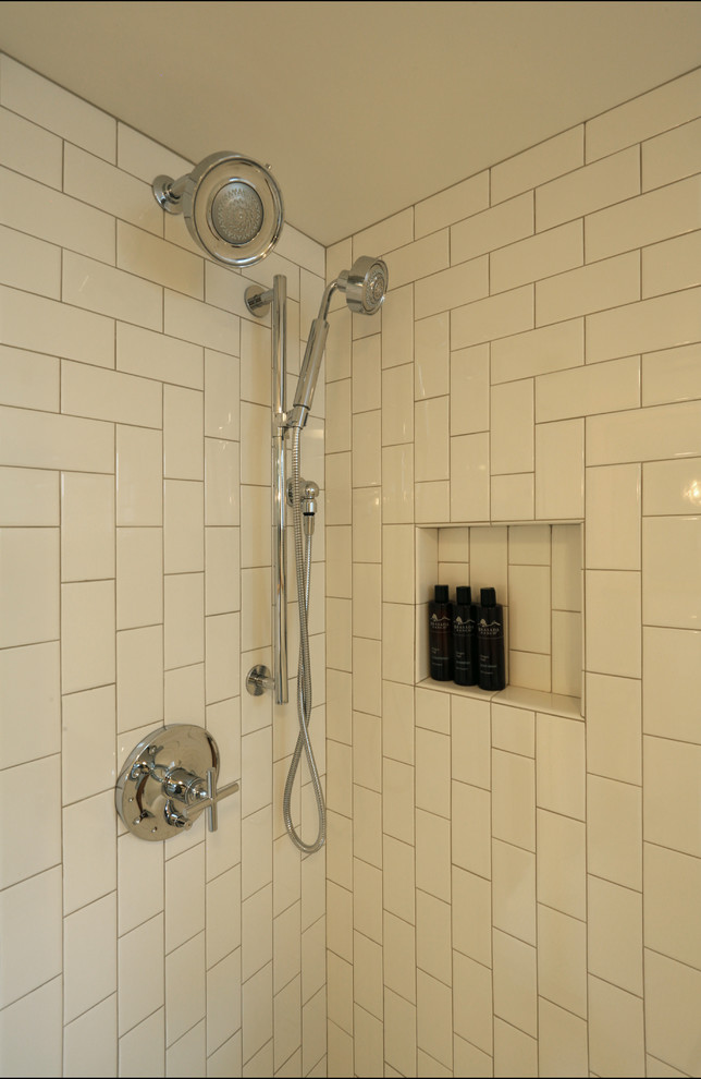 This is an example of a mid-sized traditional 3/4 bathroom in Portland with a wall-mount sink, white tile, ceramic tile, white walls and ceramic floors.