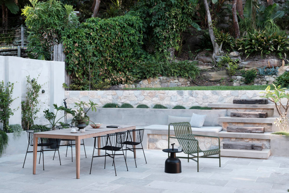 Inspiration for a large contemporary backyard patio in Sydney with no cover and natural stone pavers.