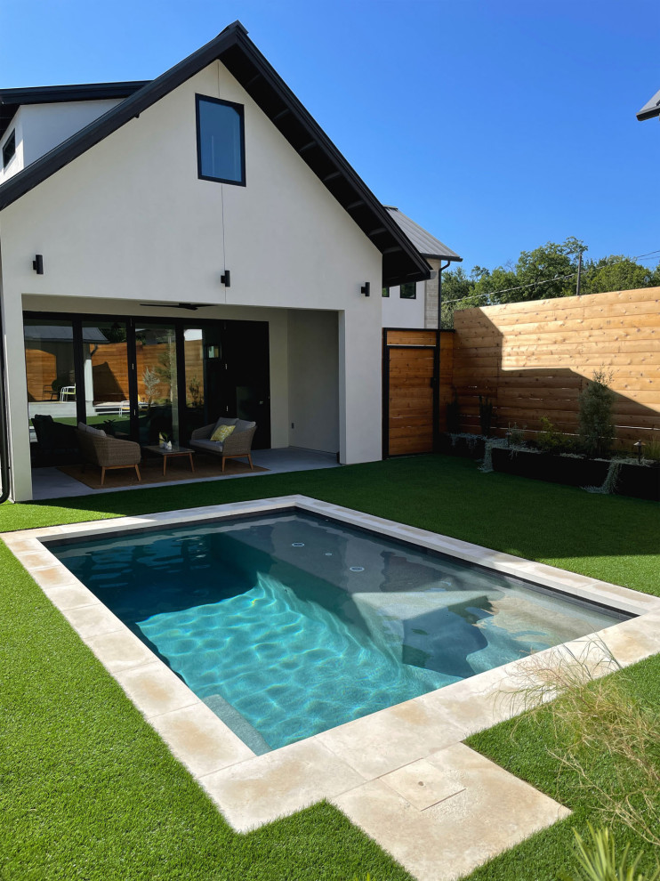 Photo of a small modern courtyard rectangular pool in Austin.