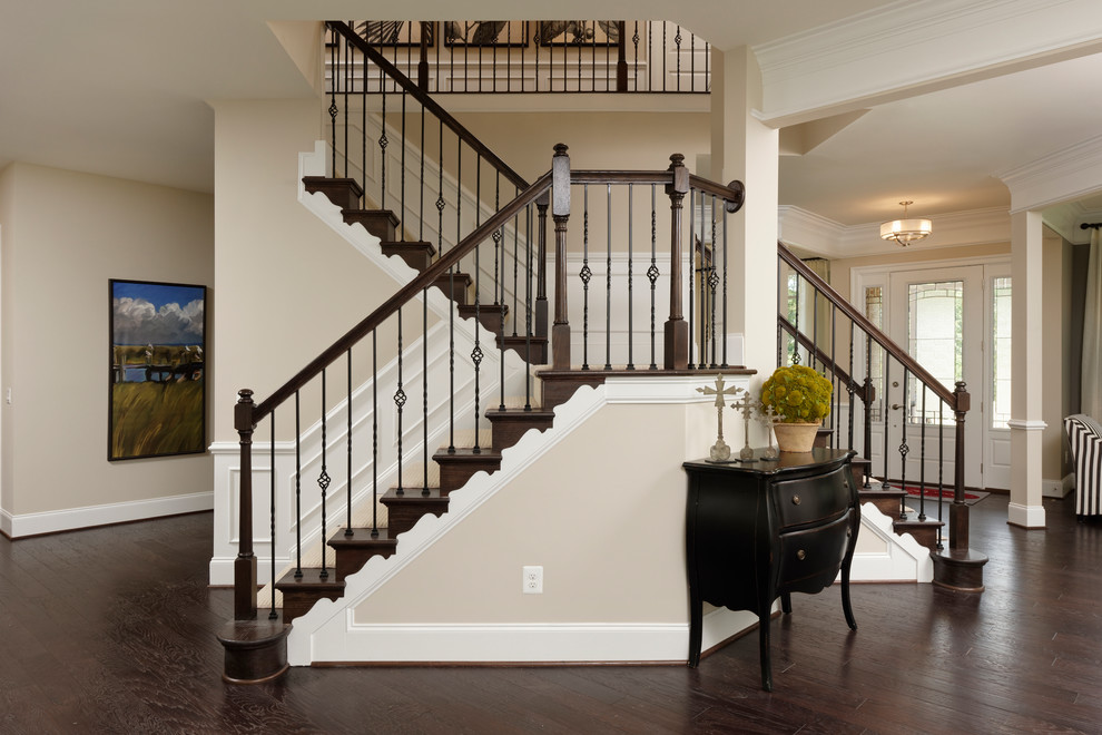 Large transitional wood curved staircase in DC Metro with wood risers.