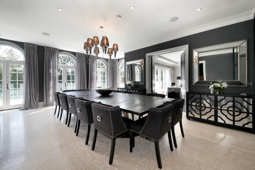 Photo of a contemporary separate dining room in Surrey with black walls and beige floor.
