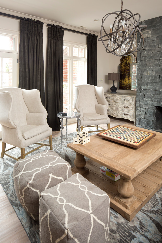 Family room - transitional open concept light wood floor family room idea in Indianapolis with gray walls, a standard fireplace and a stone fireplace