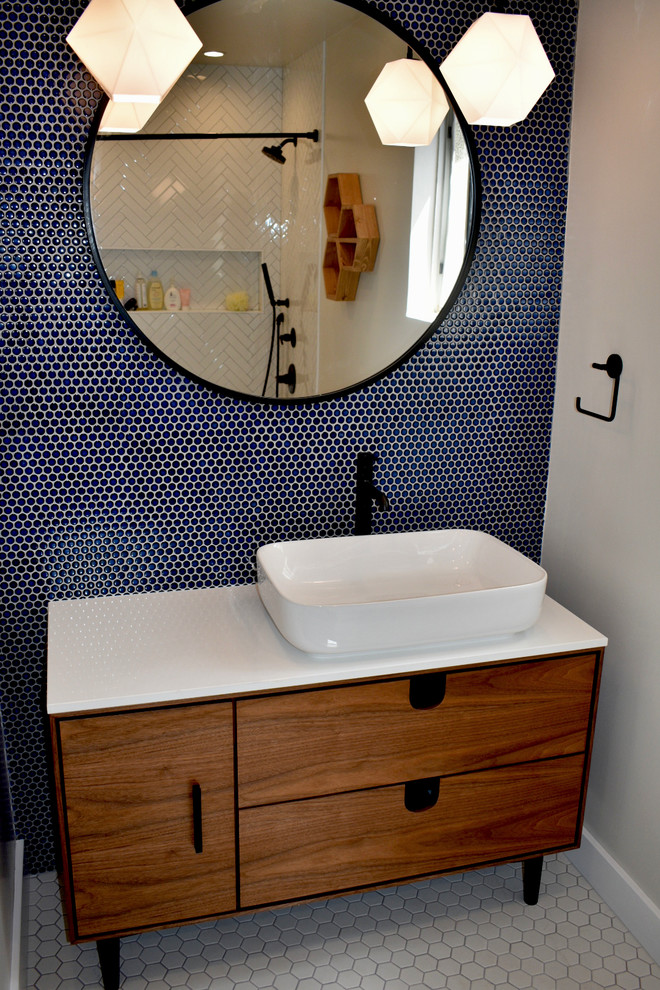 Inspiration for a mid-sized midcentury kids bathroom in Los Angeles with light wood cabinets, a drop-in tub, blue tile, porcelain tile, quartzite benchtops and white benchtops.