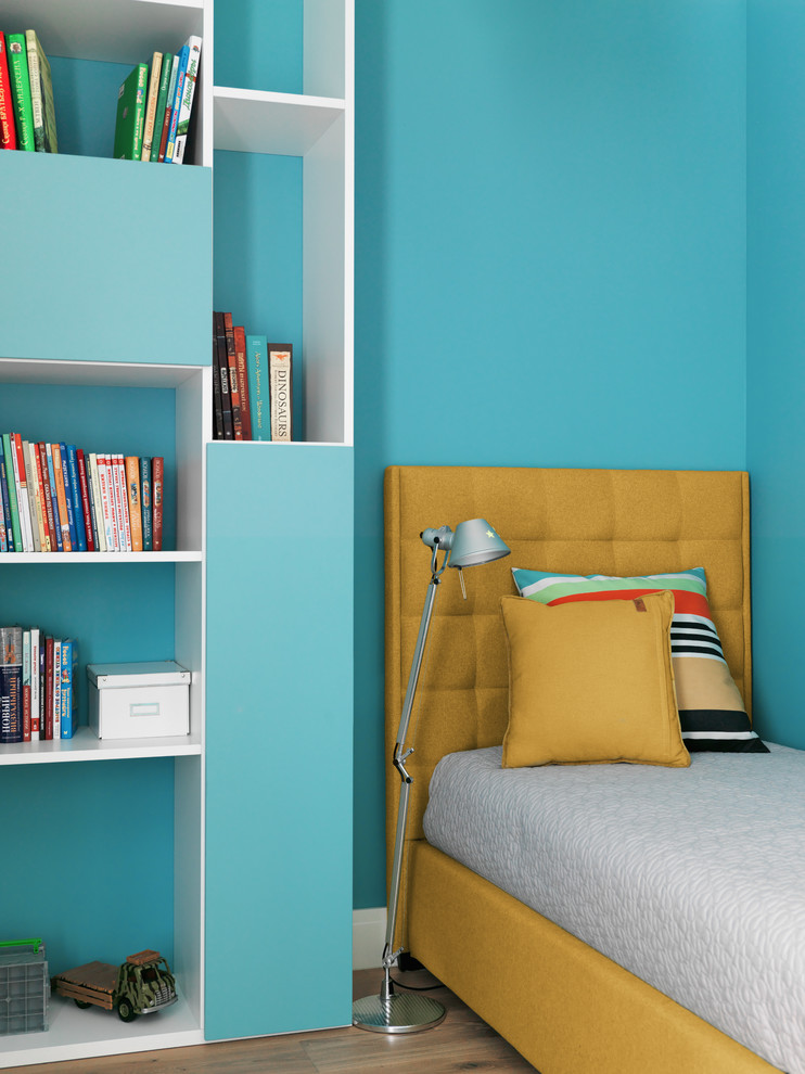 Photo of a contemporary gender-neutral kids' bedroom in Moscow with blue walls, medium hardwood floors and brown floor.