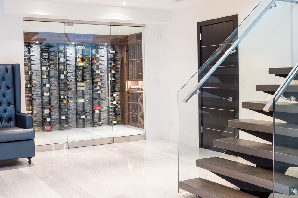 Inspiration for a mid-sized contemporary wine cellar in Toronto with marble floors and display racks.