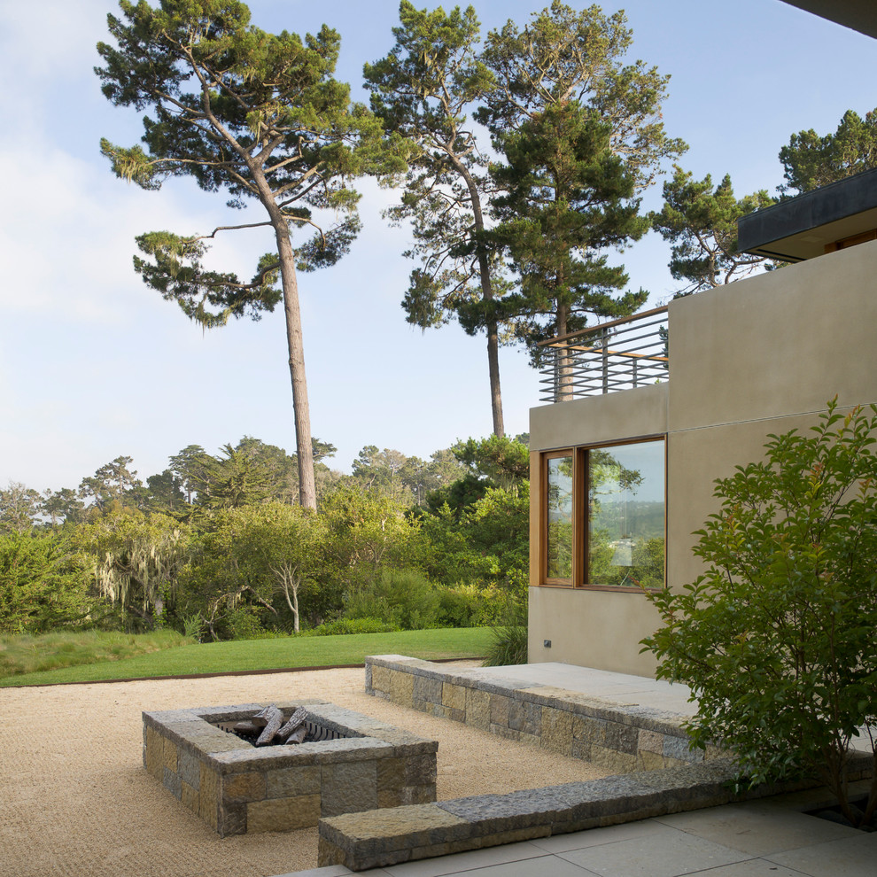 This is an example of a contemporary patio in San Francisco with a fire feature.
