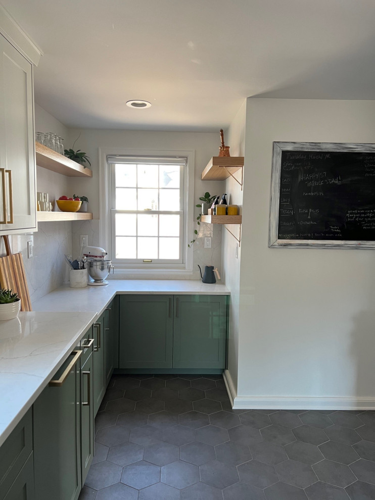 This is an example of a small transitional galley separate kitchen in Indianapolis with an undermount sink, shaker cabinets, green cabinets, quartz benchtops, white splashback, engineered quartz splashback, stainless steel appliances, porcelain floors, no island, grey floor and yellow benchtop.
