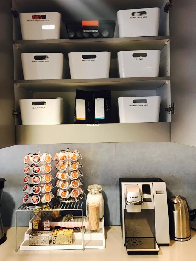 Enclosed kitchen - small transitional single-wall enclosed kitchen idea in Boston with flat-panel cabinets, solid surface countertops, gray backsplash and no island
