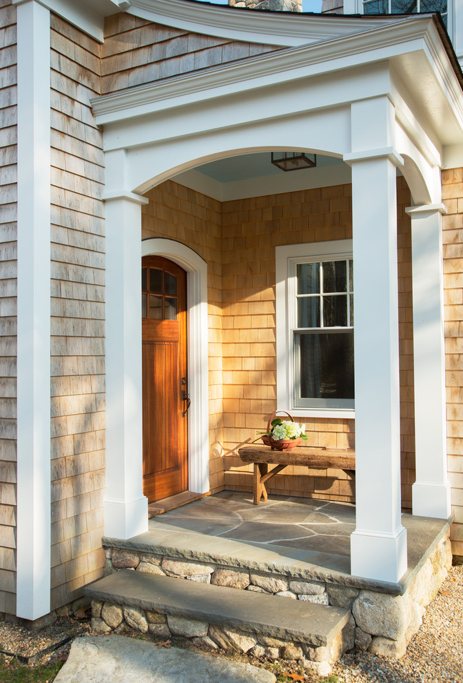 Design ideas for a traditional entryway in Boston with light hardwood floors and a single front door.
