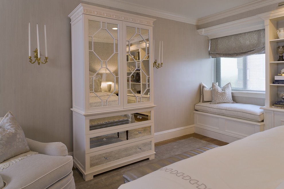 This is an example of a transitional bedroom in New York with grey walls.