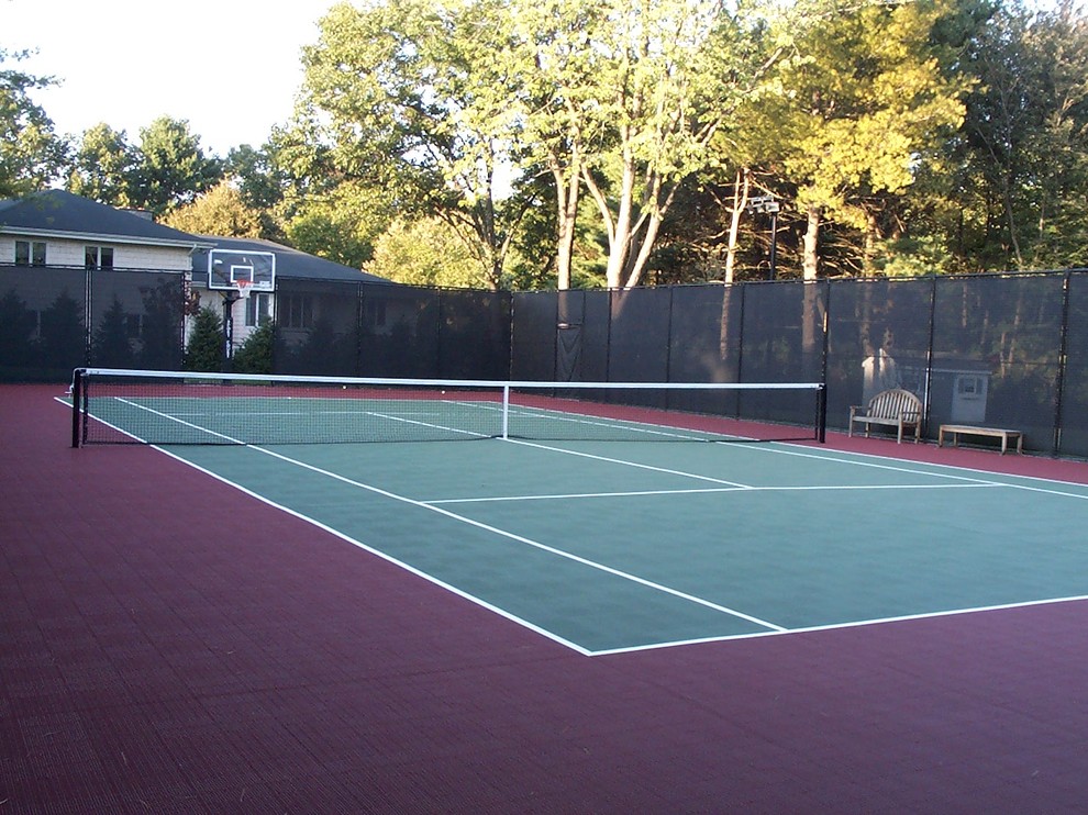 Design ideas for a large traditional backyard partial sun outdoor sport court in Boston with with outdoor playset and concrete pavers.