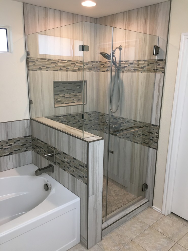 Design ideas for a mid-sized transitional master bathroom in Austin with recessed-panel cabinets, medium wood cabinets, an alcove tub, a corner shower, a two-piece toilet, gray tile, porcelain tile, beige walls, porcelain floors, an undermount sink, granite benchtops, beige floor, a hinged shower door and multi-coloured benchtops.
