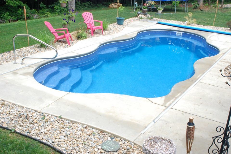 Mid-sized backyard custom-shaped pool photo in Indianapolis