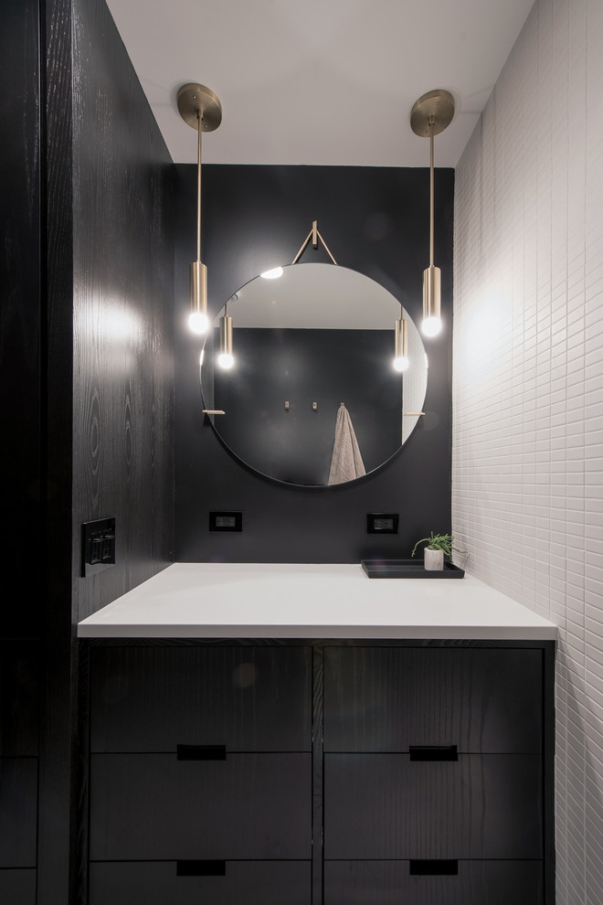 Inspiration for a small modern 3/4 bathroom in Minneapolis with flat-panel cabinets, dark wood cabinets, an alcove shower, white tile, porcelain tile, black walls, porcelain floors, a vessel sink and engineered quartz benchtops.